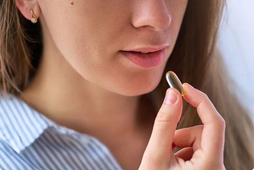 Woman taking supplement